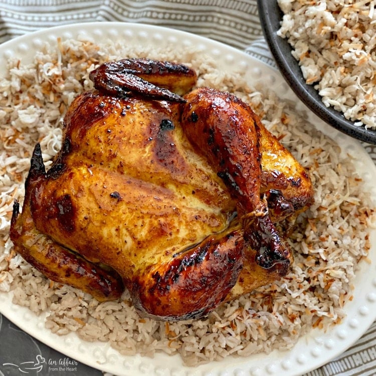 Jamaican Jerk Glazed Chicken over Sweet Coconut Rice on a white platter